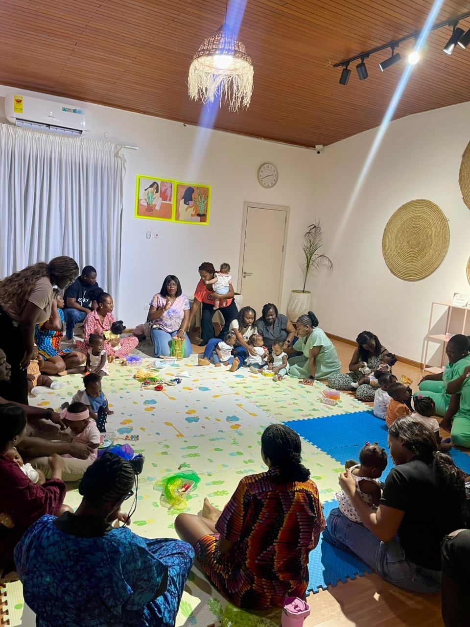 Mothers and babies gathered for a Baby & Me class