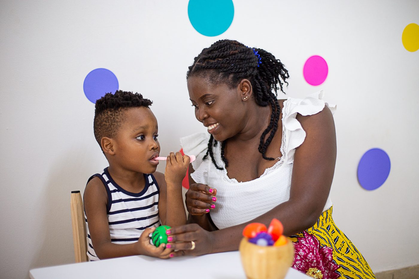 A child playing with speech therapy cards